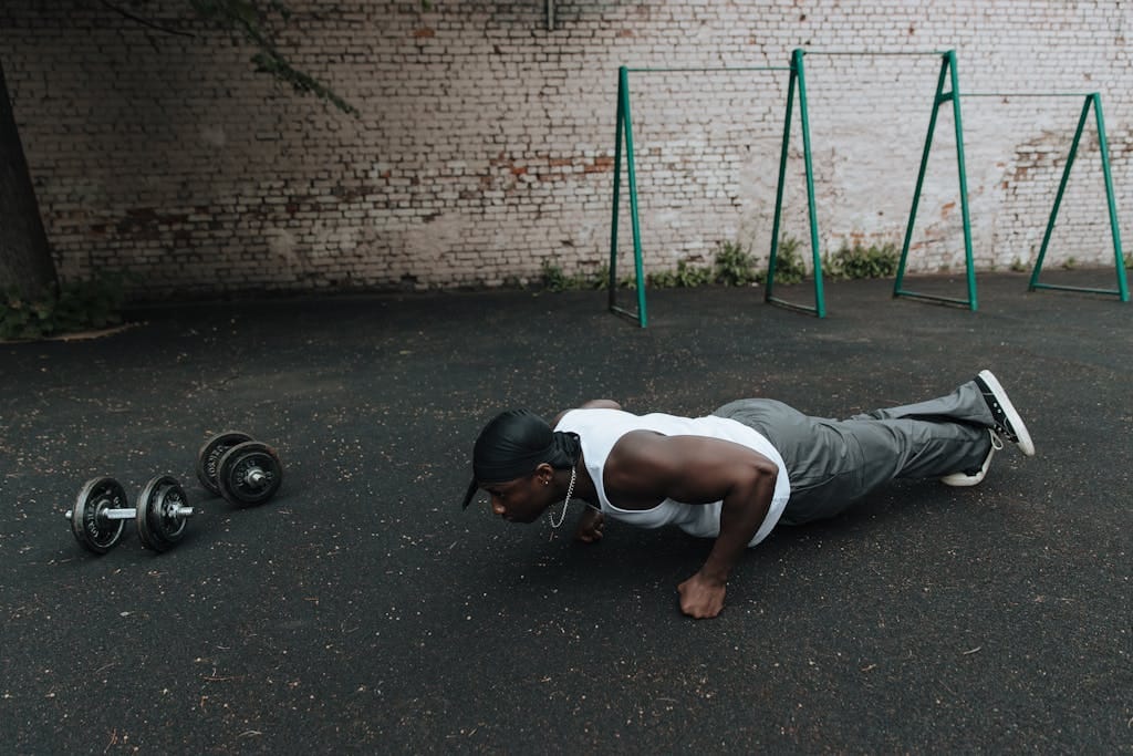 Man Doing Pump ups near Dumbbells